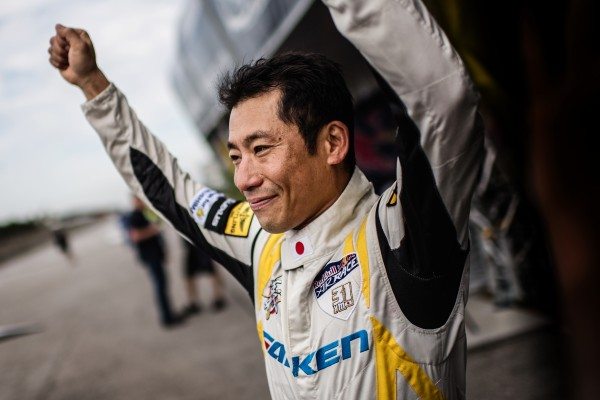 Yoshihide Muroya of Japan arrives after he won the finals of the third stage of the Red Bull Air Race World Championship in Chiba, Japan on June 5, 2016