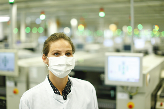 Masks, worn by Continental employees at the firm’s Regensburg’s electronics centre, are just one outward sign of what is taking place as a result of the coronavirus