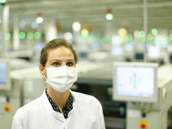 Masks, worn by Continental employees at the firm’s Regensburg’s electronics centre, are just one outward sign of what is taking place as a result of the coronavirus