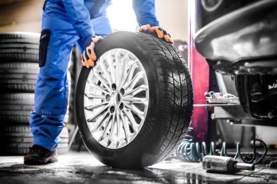 technician handles new tyre